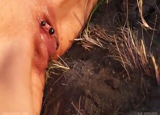 Slim brunette girl found a couple of ants for her pierced pussy